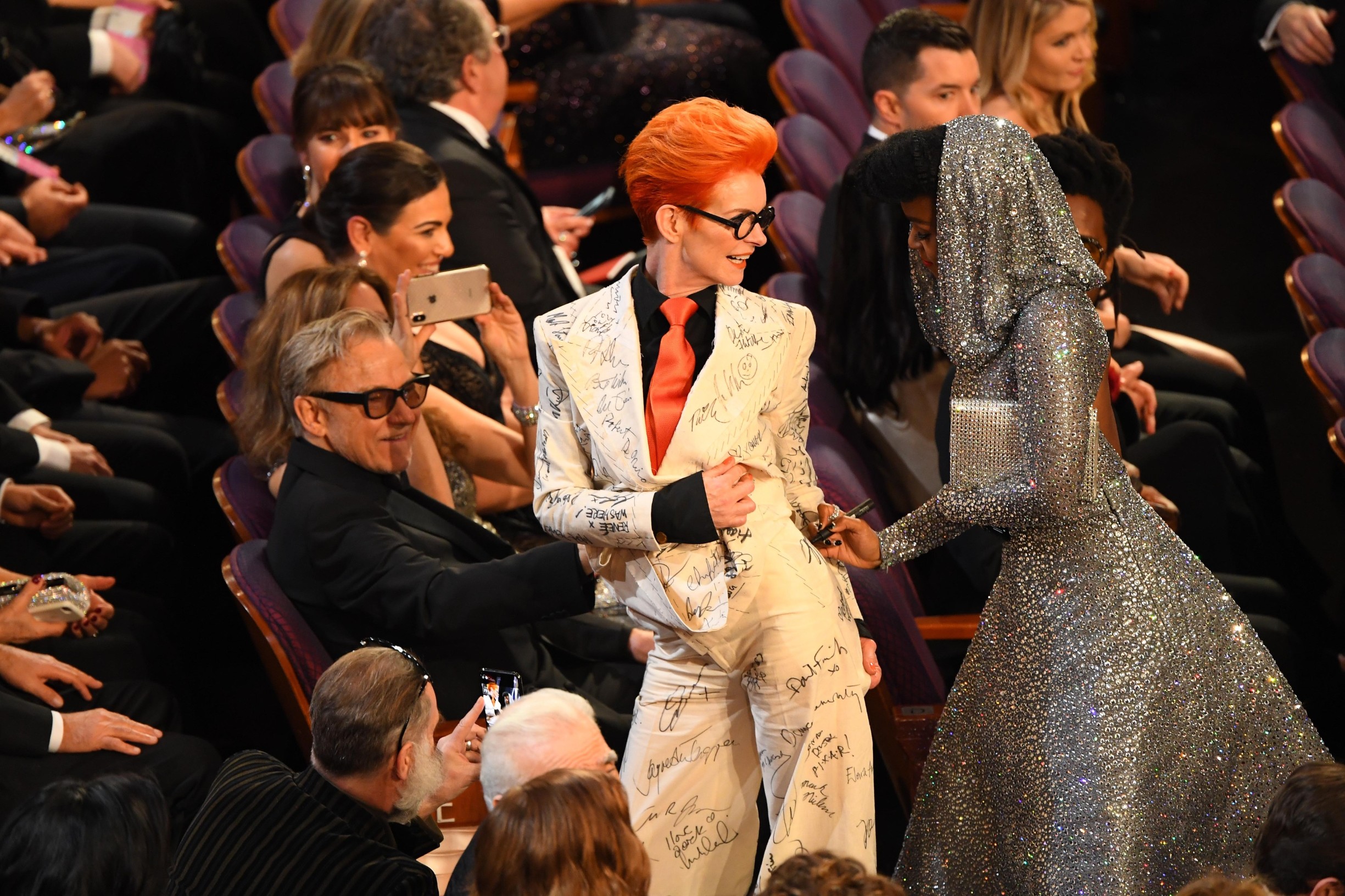 Feb 9, 2020; Los Angeles, CA, USA;   Janelle Monae (right) signs the suit of costume designer Sandy Powell during a break in the 92nd Academy Awards at Dolby Theatre., Image: 497502973, License: Rights-managed, Restrictions: *** World Rights ***, Model Release: no, Credit line: USA TODAY Network / ddp USA / Profimedia